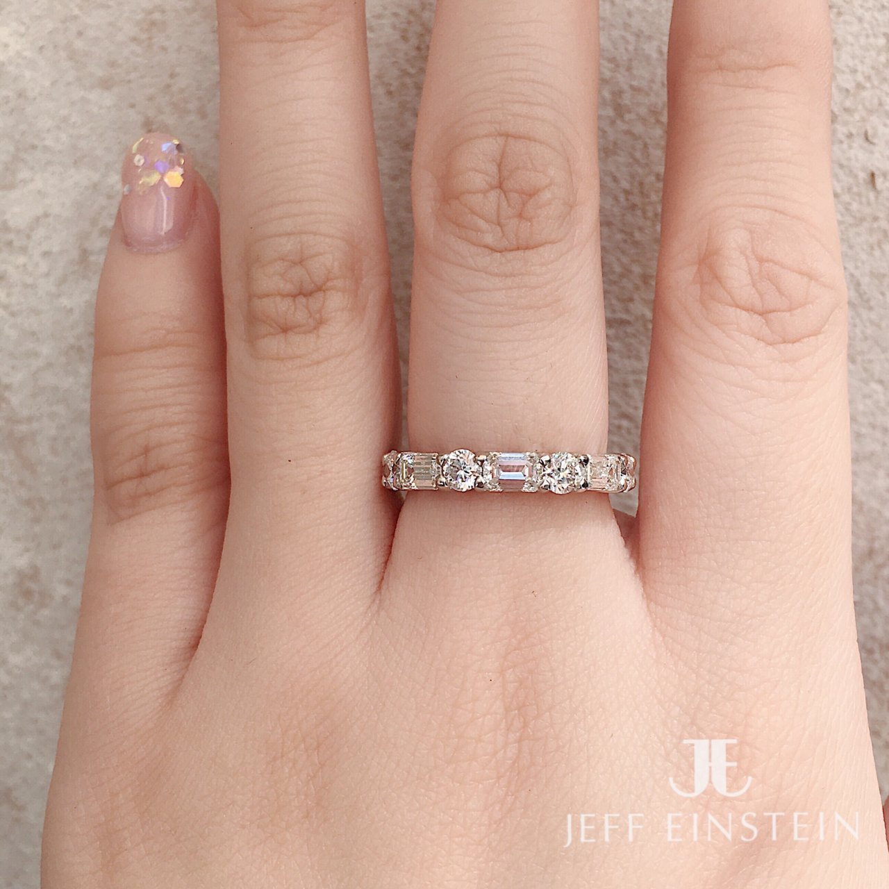 Platinum Emerald and Round Brilliant Cut Diamond Band