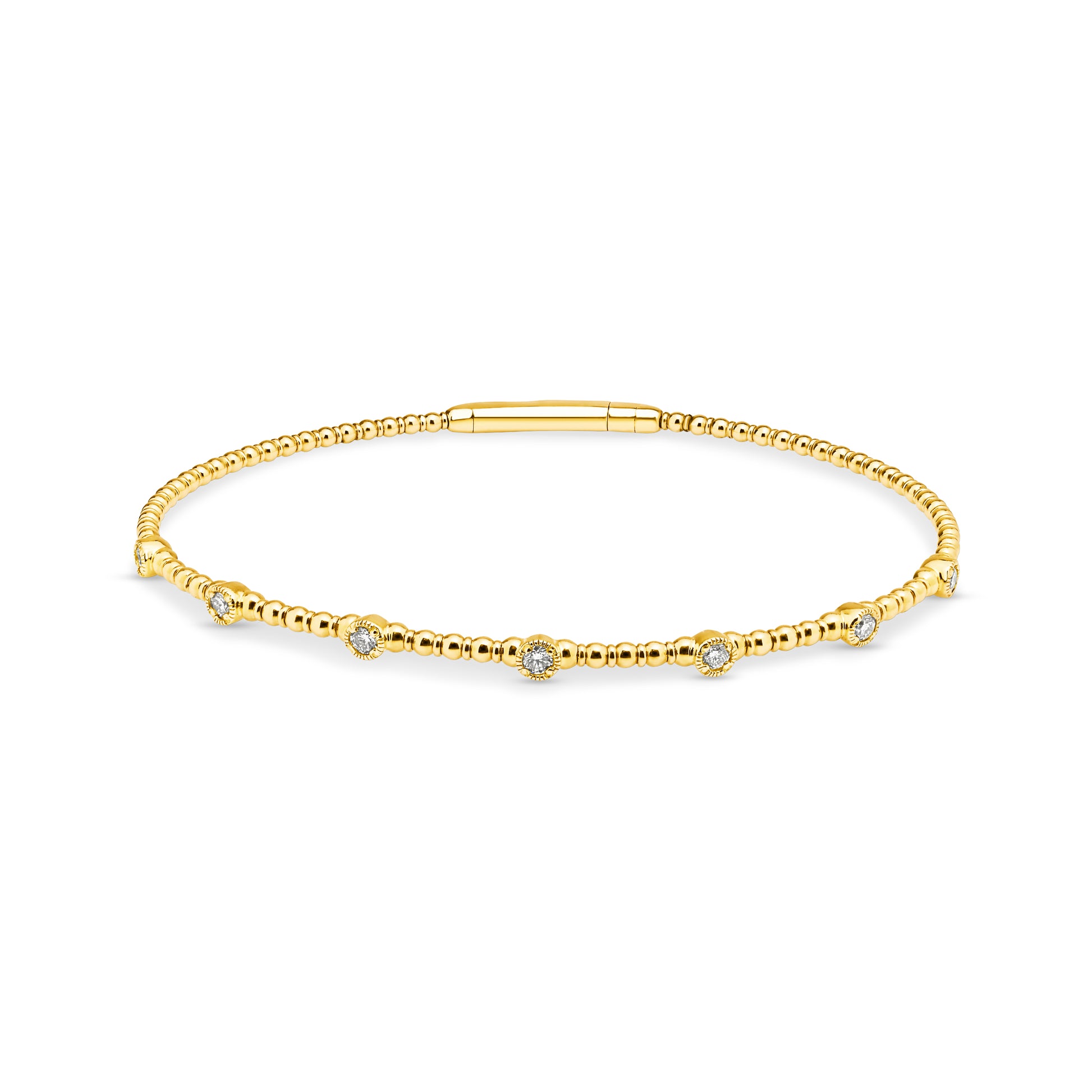 14ct yellow gold granule style bangle featuring 7 diamonds set into individual round stations weighing a total of 0.24ct. Flexi-style bangle with an easy close clasp